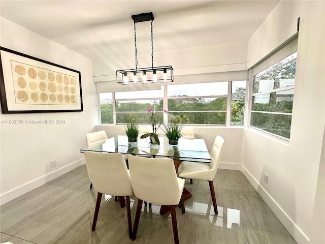 dining room featuring a notable chandelier and hardwood / wood-style flooring