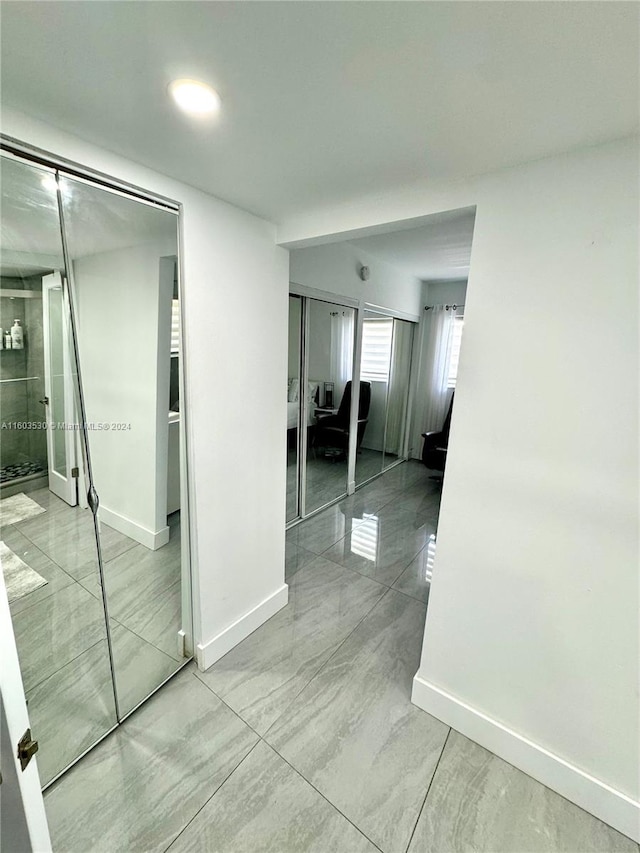 hallway featuring tile flooring