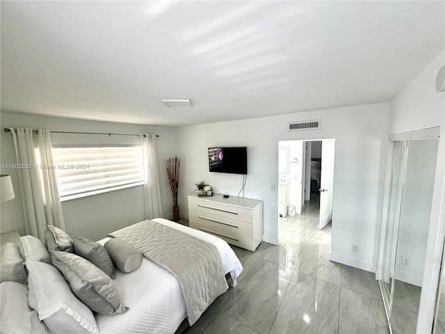 bedroom featuring light tile floors