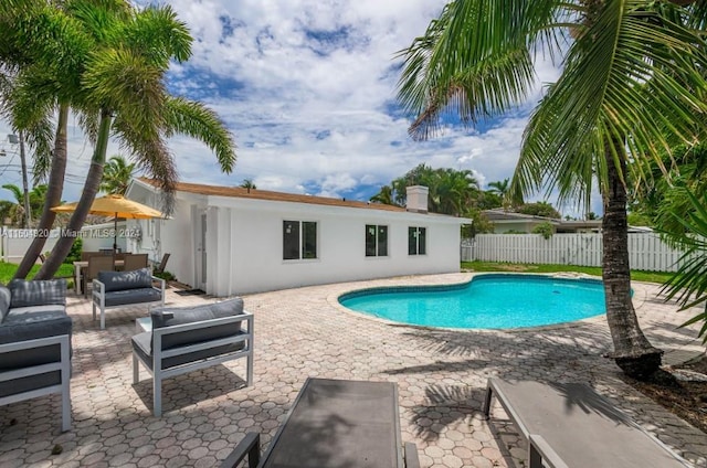 view of pool featuring outdoor lounge area and a patio area