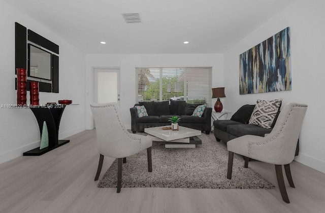 living room with light hardwood / wood-style floors