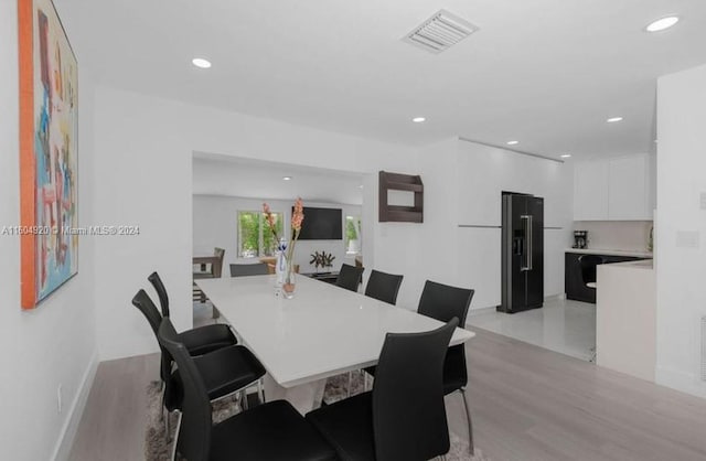 dining room with light hardwood / wood-style floors