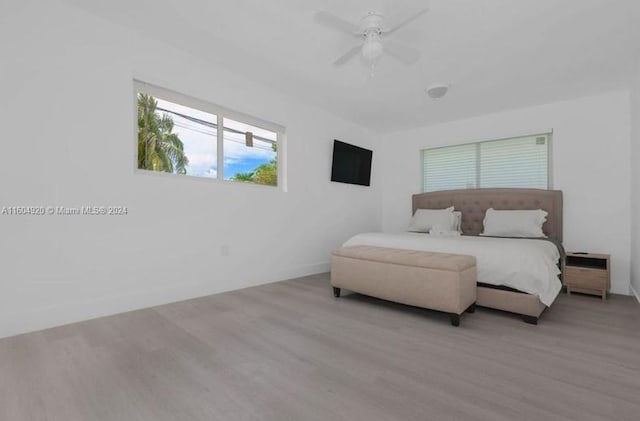 bedroom featuring light wood-type flooring and ceiling fan