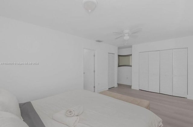 bedroom with ceiling fan and light hardwood / wood-style floors