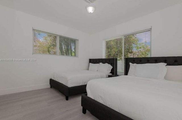 bedroom with light hardwood / wood-style flooring