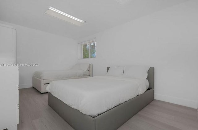 bedroom with light wood-type flooring