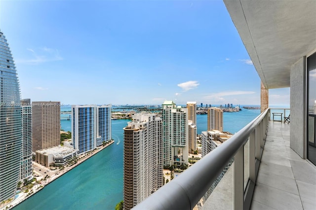 balcony featuring a water view