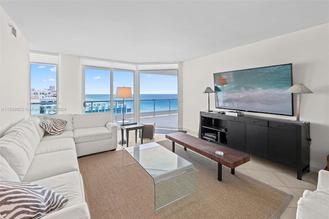 tiled living room with floor to ceiling windows