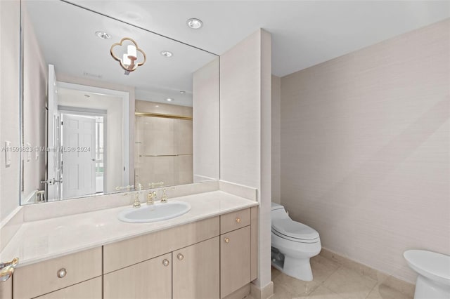 bathroom with tile patterned floors, vanity, toilet, and an enclosed shower