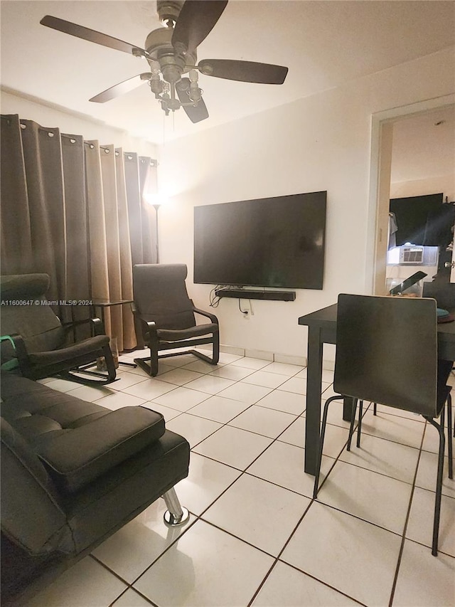 living room featuring light tile patterned floors and ceiling fan