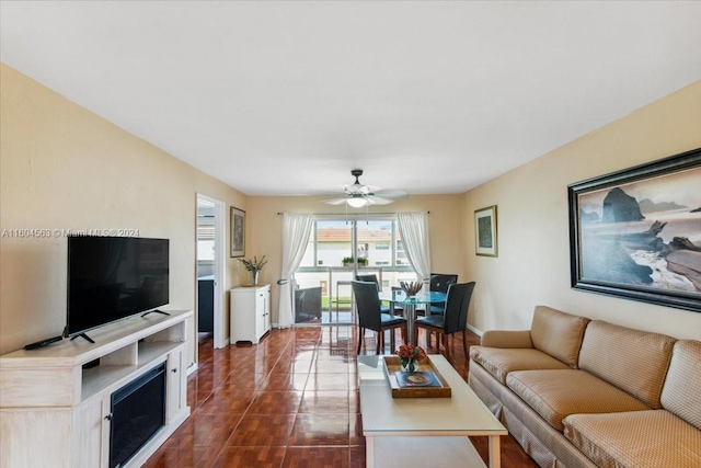 tiled living room with ceiling fan