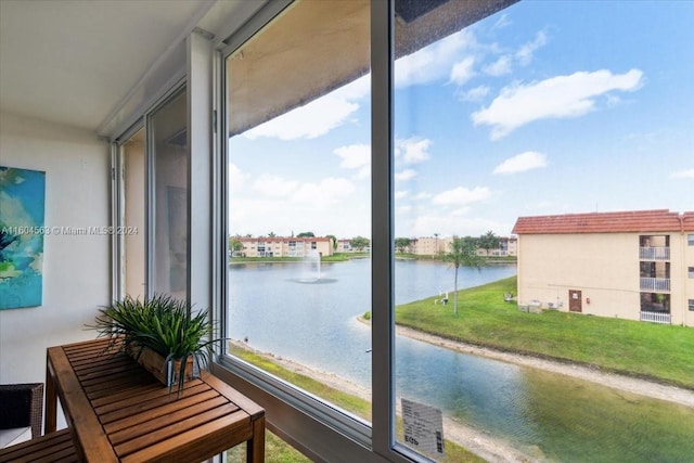 balcony featuring a water view