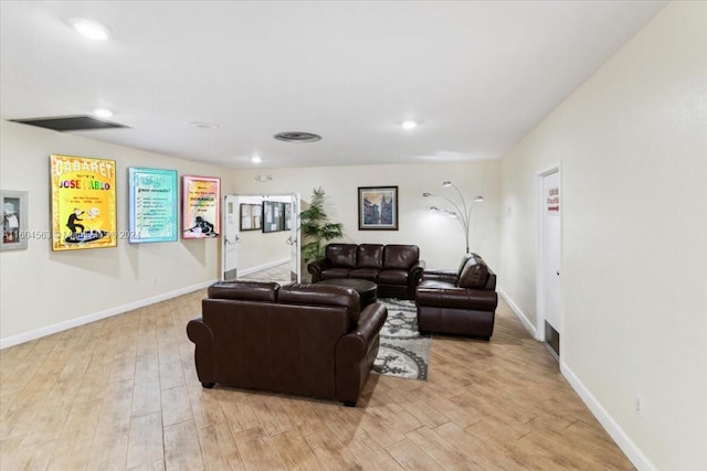 living room with light hardwood / wood-style flooring