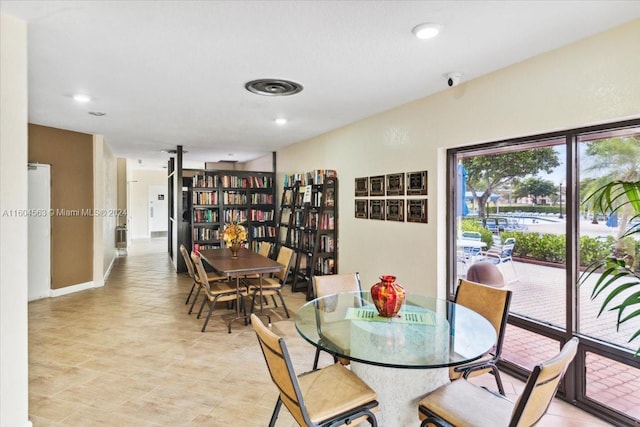 dining area with light tile flooring