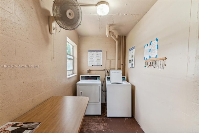 laundry area with separate washer and dryer