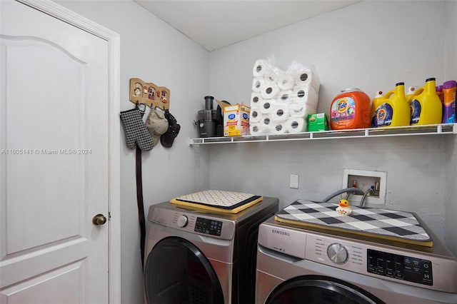 washroom with washer and dryer