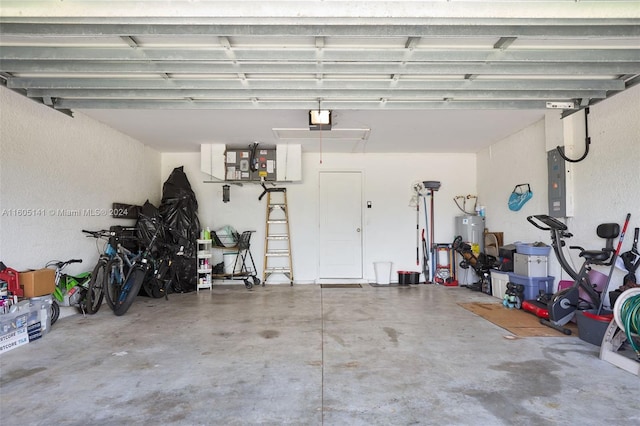 garage with electric panel, water heater, and a garage door opener