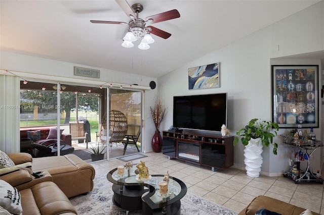 tiled living room featuring ceiling fan and vaulted ceiling