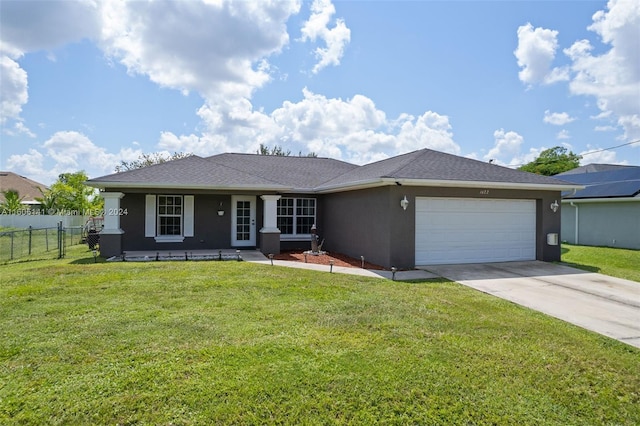 single story home featuring a front yard and a garage