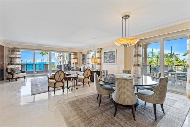 tiled dining area featuring ornamental molding