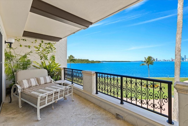 balcony featuring a water view