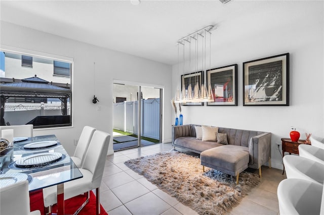 living area featuring tile patterned flooring and track lighting