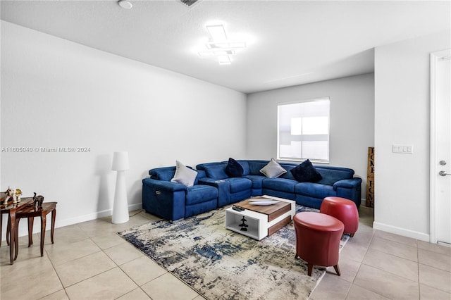 living area with tile patterned flooring and baseboards