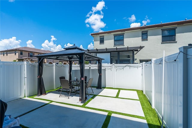 view of patio / terrace featuring a pergola and a gazebo