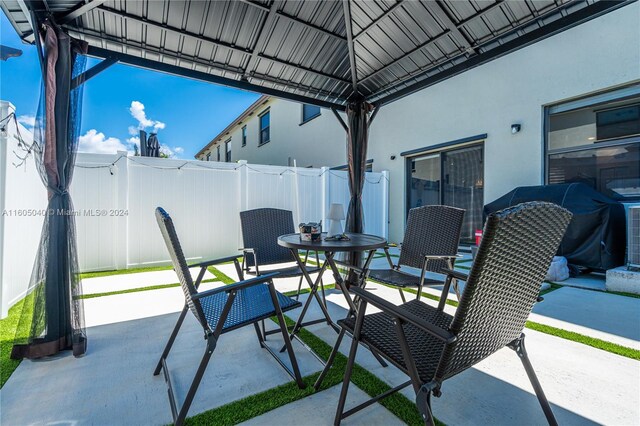 view of terrace with a gazebo