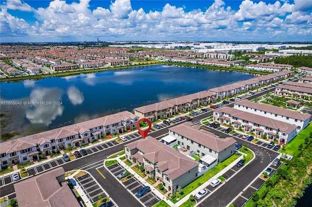 bird's eye view with a residential view and a water view