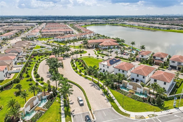 birds eye view of property with a water view and a residential view