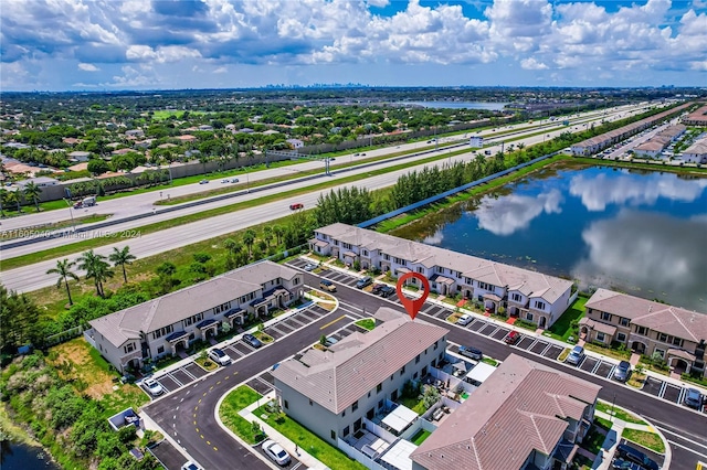 aerial view featuring a water view and a residential view