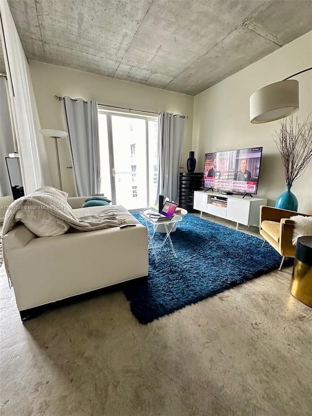 living room featuring concrete flooring