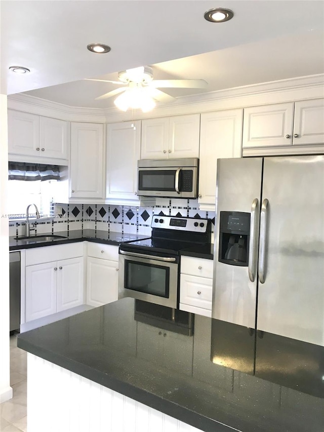 kitchen featuring sink, ceiling fan, white cabinets, and stainless steel appliances