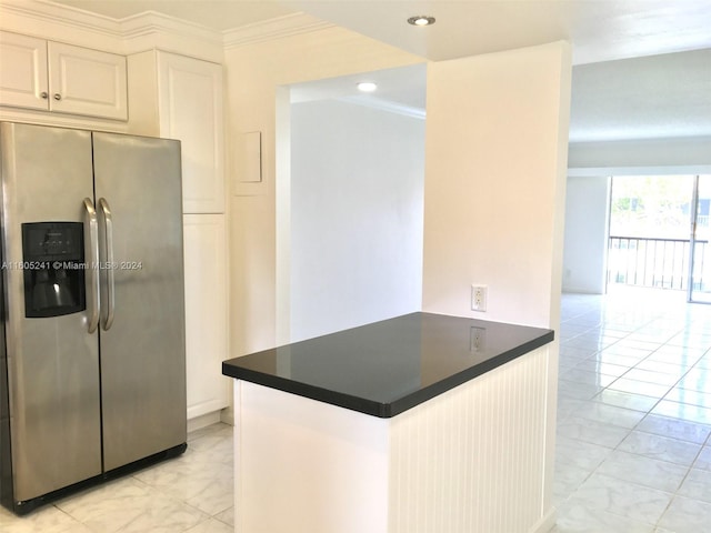 kitchen featuring white cabinetry, kitchen peninsula, ornamental molding, stainless steel fridge, and light tile patterned floors