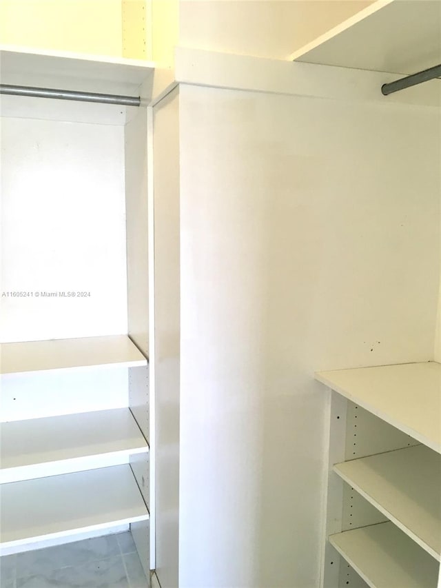 walk in closet featuring tile patterned floors