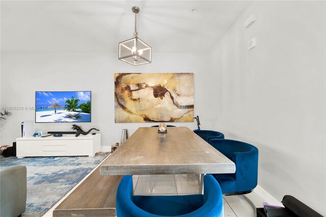 dining space featuring a chandelier