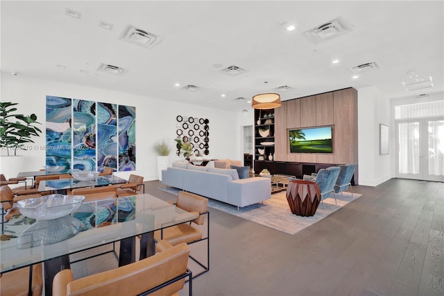 living room with hardwood / wood-style floors and french doors