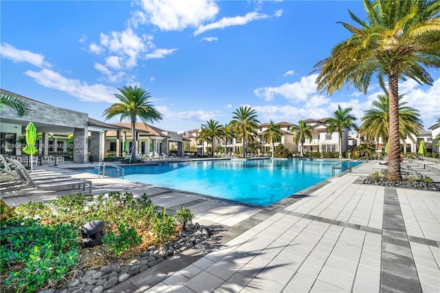 view of swimming pool featuring a patio area