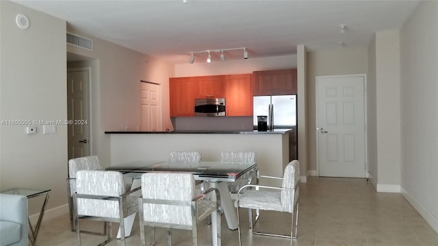 kitchen featuring kitchen peninsula and stainless steel appliances