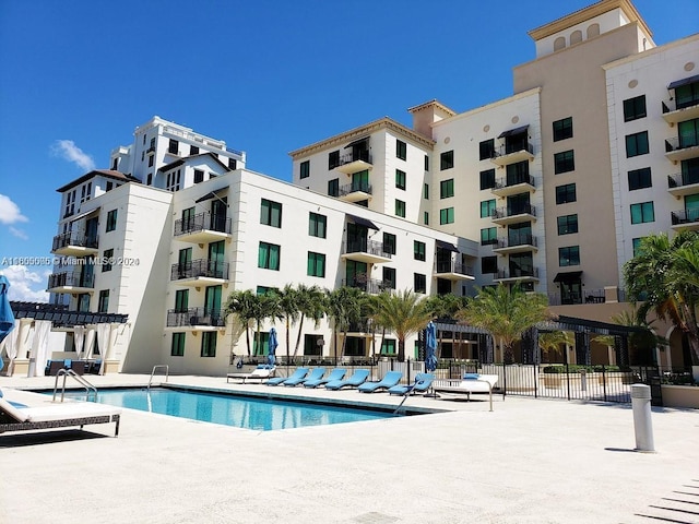 view of swimming pool with a patio