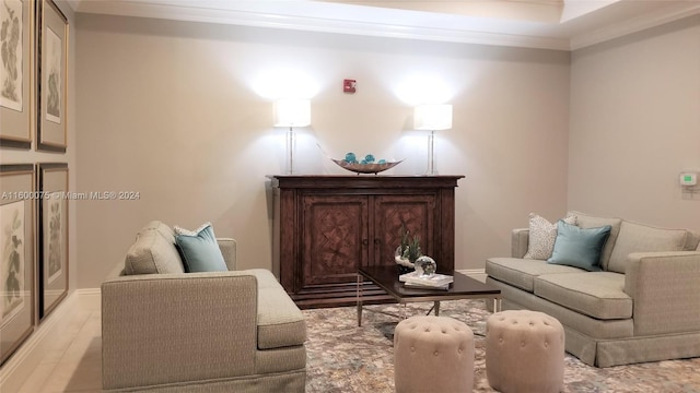 living room with hardwood / wood-style floors and ornamental molding