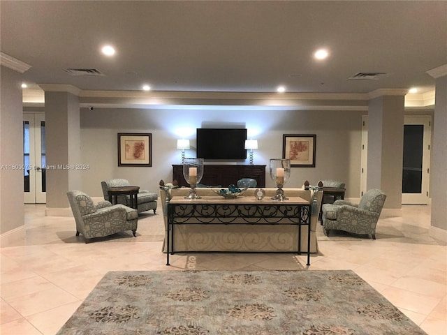 living room featuring ornamental molding and light tile floors