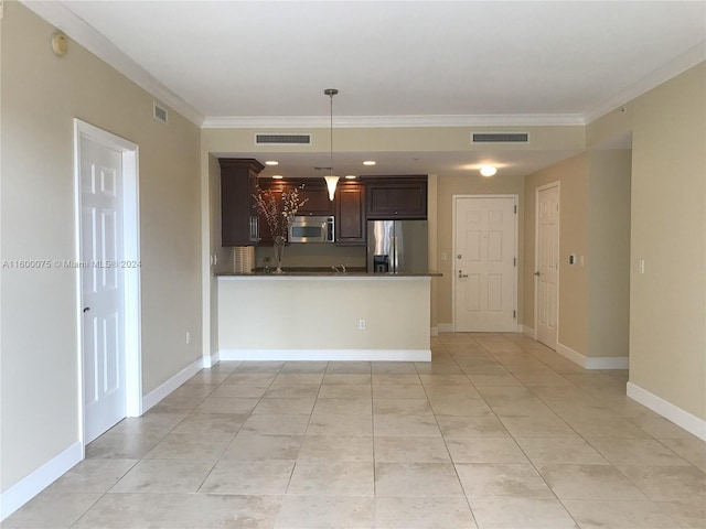 kitchen with decorative light fixtures, light tile flooring, crown molding, and stainless steel appliances