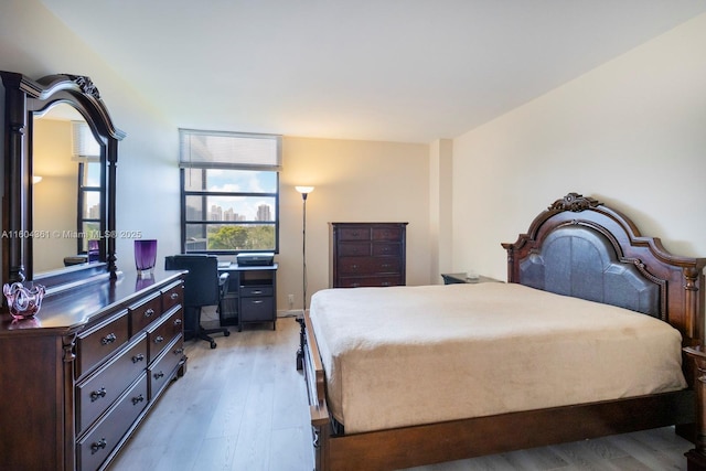 bedroom featuring light wood finished floors