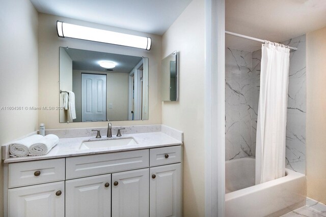 bathroom with shower / tub combo and vanity