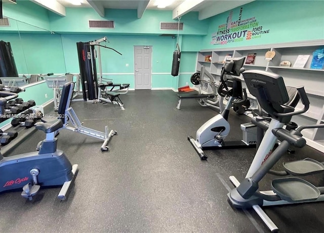 gym with visible vents and baseboards