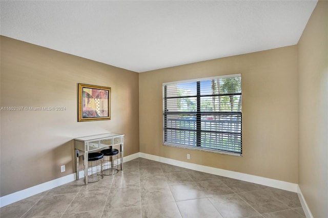 view of tiled spare room