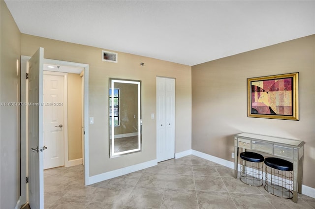 interior space with light tile patterned floors