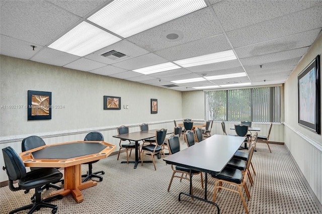 dining area with a drop ceiling